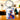 Porte-clés rectangulaire en métal argenté avec motif chat coloré.
