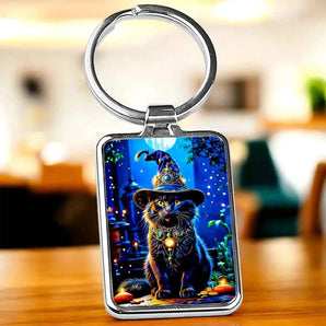Porte-clés avec image d'un chat noir portant un chapeau de sorcier.