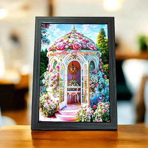 Tableau encadré d'un kiosque fleuri.